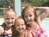 Three girls having fun at the campsites swimming pool